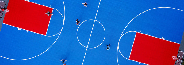 athletes playing basketball on a basketball court - basketball driveway games