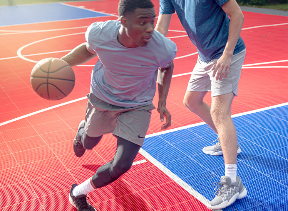 athletes playing on basketball court